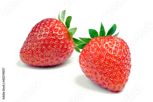 Two ripe strawberries on white background