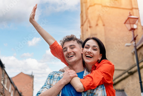 Canvas Print Outdoor portrait of couple  having a fun time in the city of England Enjoying tr