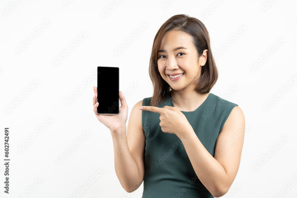 Young Asian woman showing smart phone with pointing fingers to smartphone shot isolated on white background Young Asian woman showing smart phone with pointing fingers to smartphone shot isolated on white background