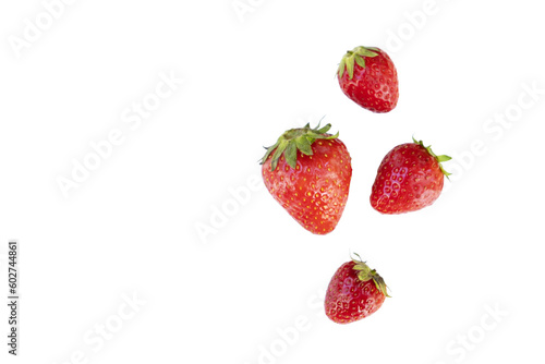 Group of four strawberries viewed from above on a white background
