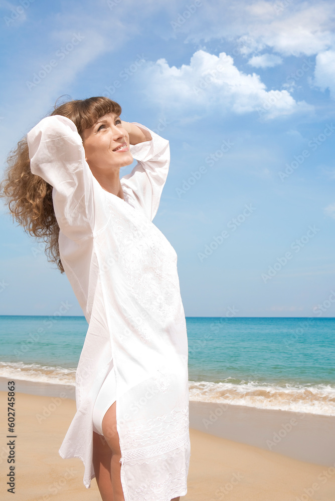 Portrait of nice young woman having good time on the beach Portrait of nice young woman having good time on the beach
