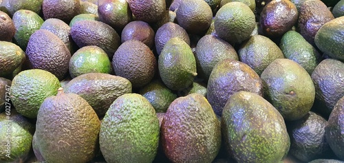 Avocado, green, black,  brown, texture, revenue collection at central de abastos, mexico, cdmx photo