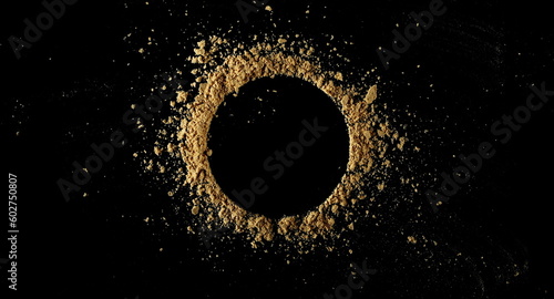 Ginger root powder isolated on black, top view