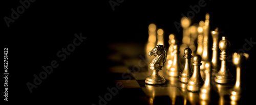 Pieces on chess board for playing game and strategy Golden chess
