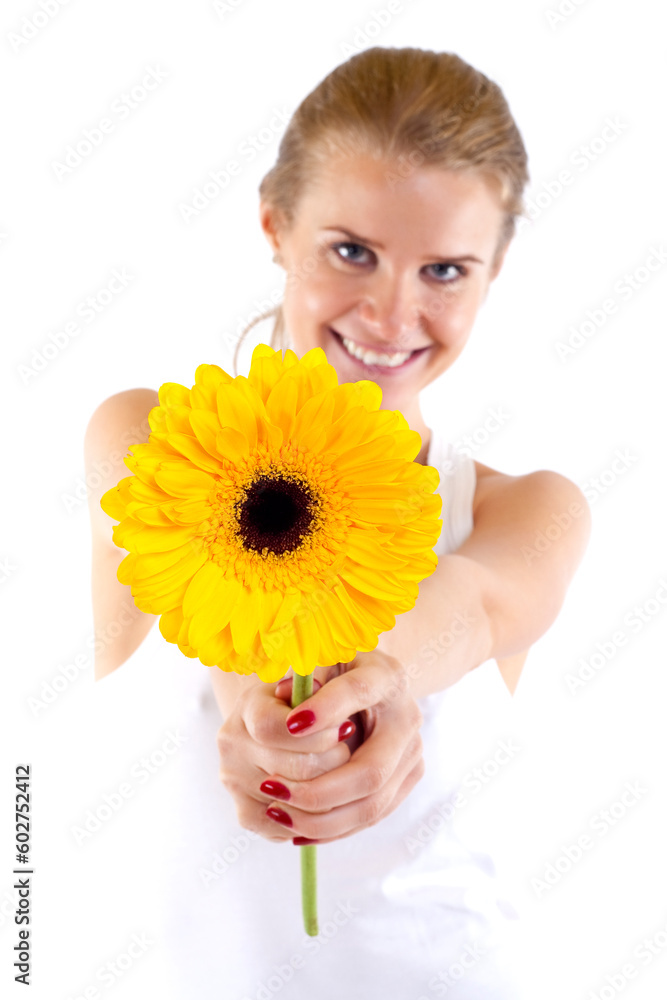 Beautiful angelic woman with flower in her hands - focus is on the flower Beautiful angelic woman with flower in her hands - focus is on the flower