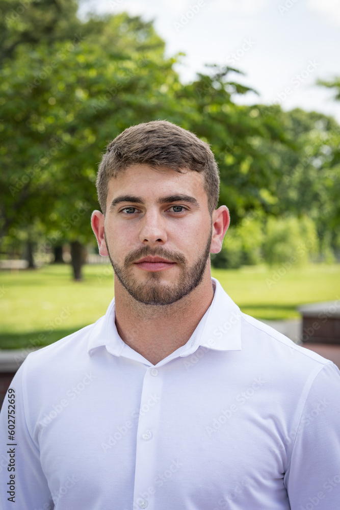 Close up portrait of bearded young man in a park Close up portrait of bearded young man in a park
