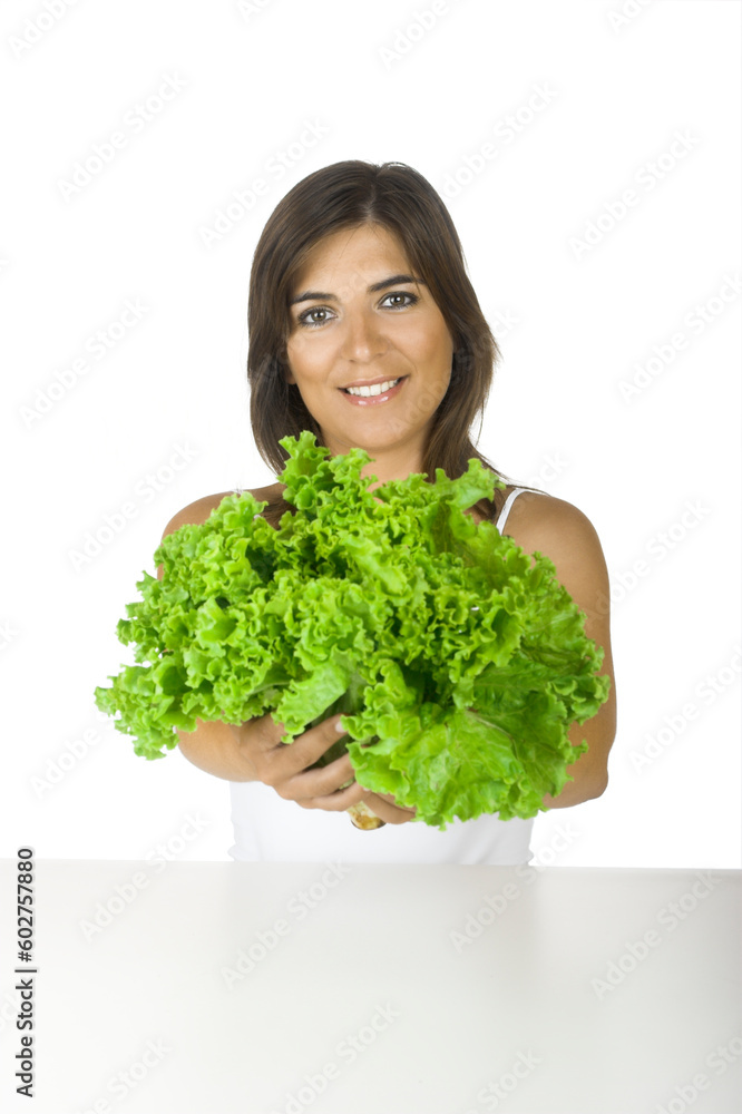 Beautiful young woman holding a healthy lettuce on her hands Beautiful young woman holding a healthy lettuce on her hands