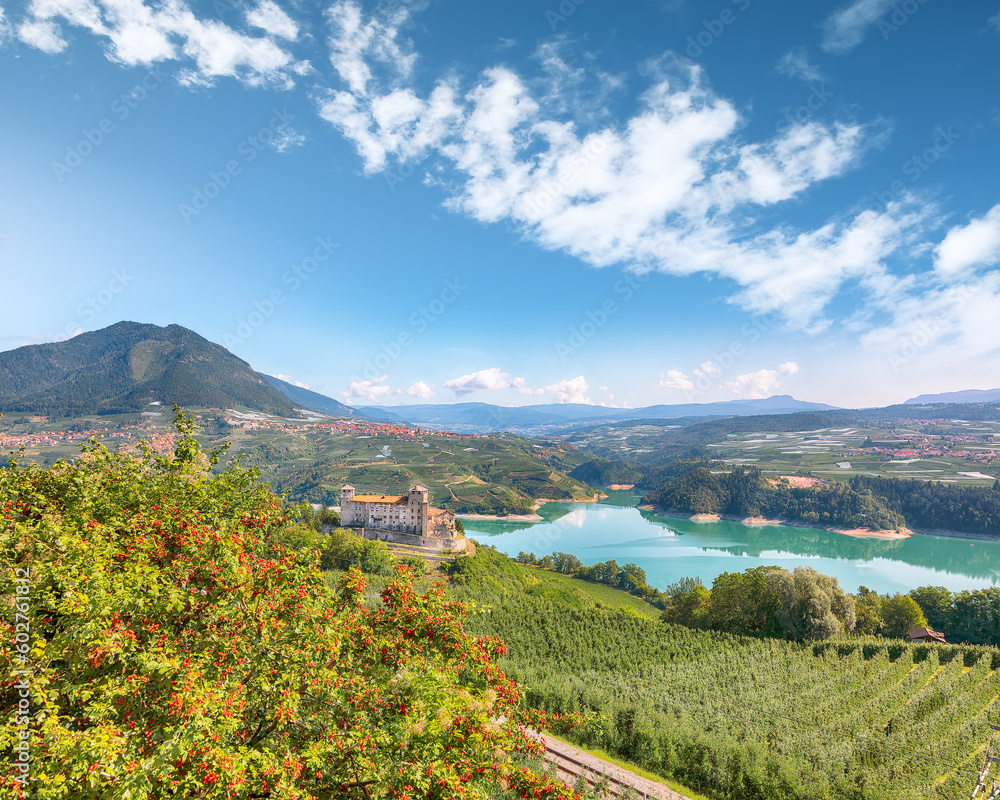 Fototapeta premium Fabulous View of the Cles Castel, the Santa Giustina Lake and lots of apple plantations.