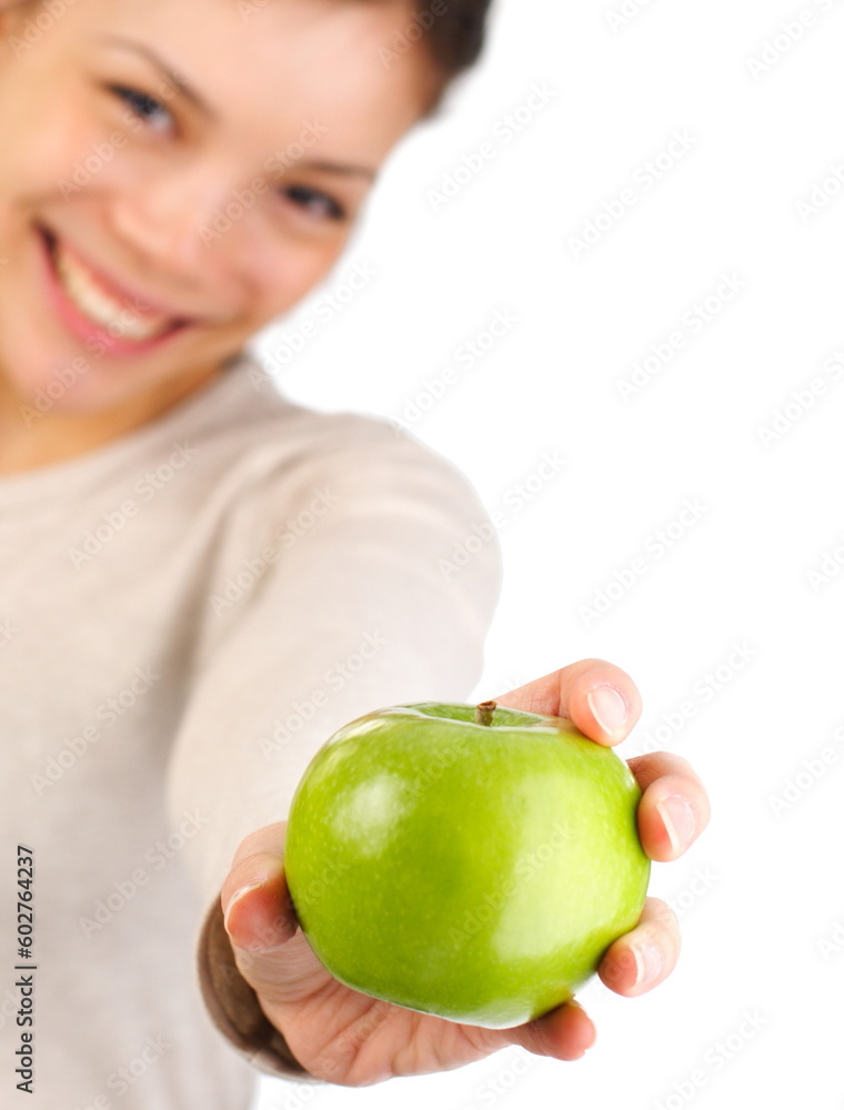 Green apple. Beautiful autumn woman giving you an apple. Isolated on white background. Shallow depth of field, focus on the apple Green apple. Beautiful autumn woman giving you an apple. Isolated on white background. Shallow depth of field, focus on the apple