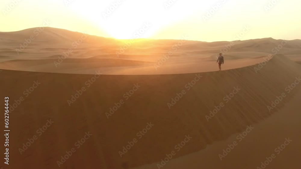 Drone, desert or man travel in Dubai for sunset, nature beauty on dry land, horizon or Africa sahara. Hill, earth or freedom in saudi arabia, wasteland or sand landscape in morning sunrise on summer Drone, desert or man travel in Dubai for sunset, nature beauty on dry land, horizon or Africa sahara. Hill, earth or freedom in saudi arabia, wasteland or sand landscape in morning sunrise on summer