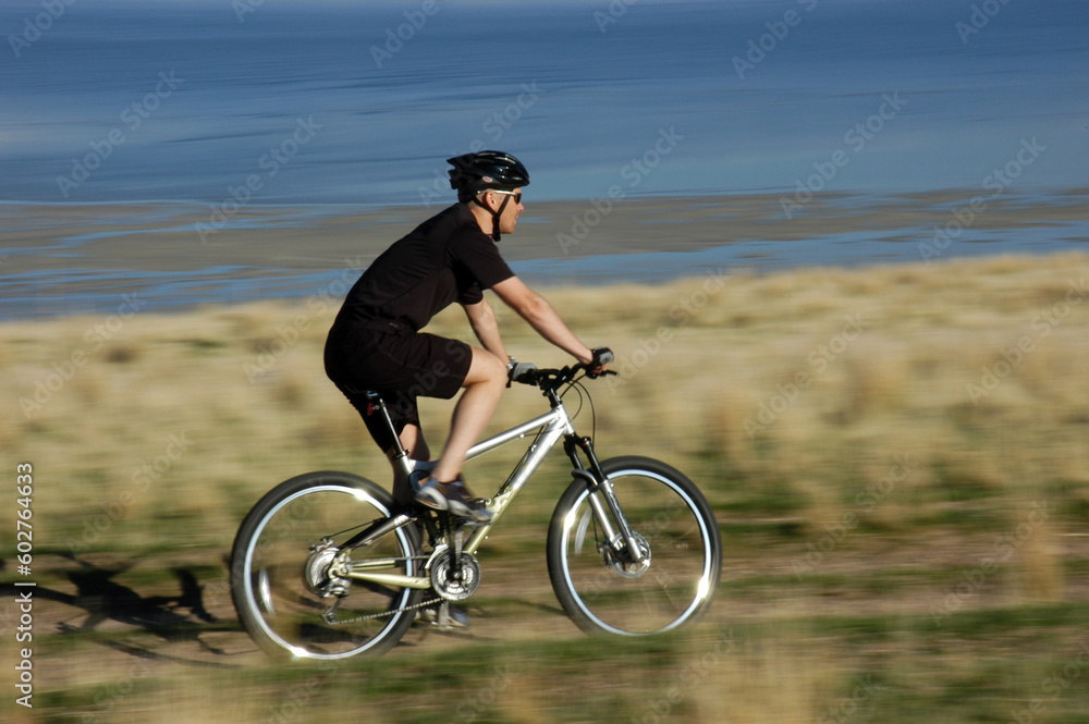 Blur of man on mountain bike, Antelope Island, Utah Blur of man on mountain bike, Antelope Island, Utah