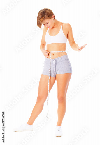 Young woman measuring herself with a measuring tape, from a complete series of photos.