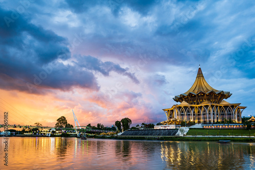 Kuching city waterfront sunset with river and landmarks in Sarawak, Malaysia.  photo