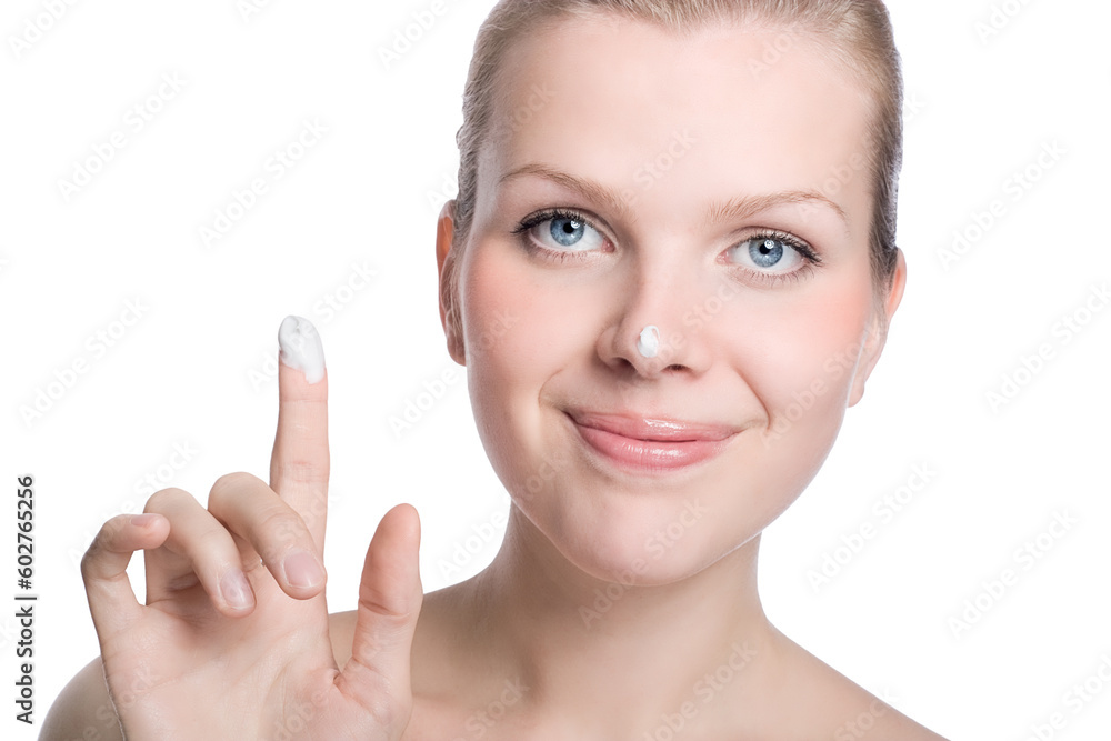 beautiful women applying cream to her nose beautiful women applying cream to her nose
