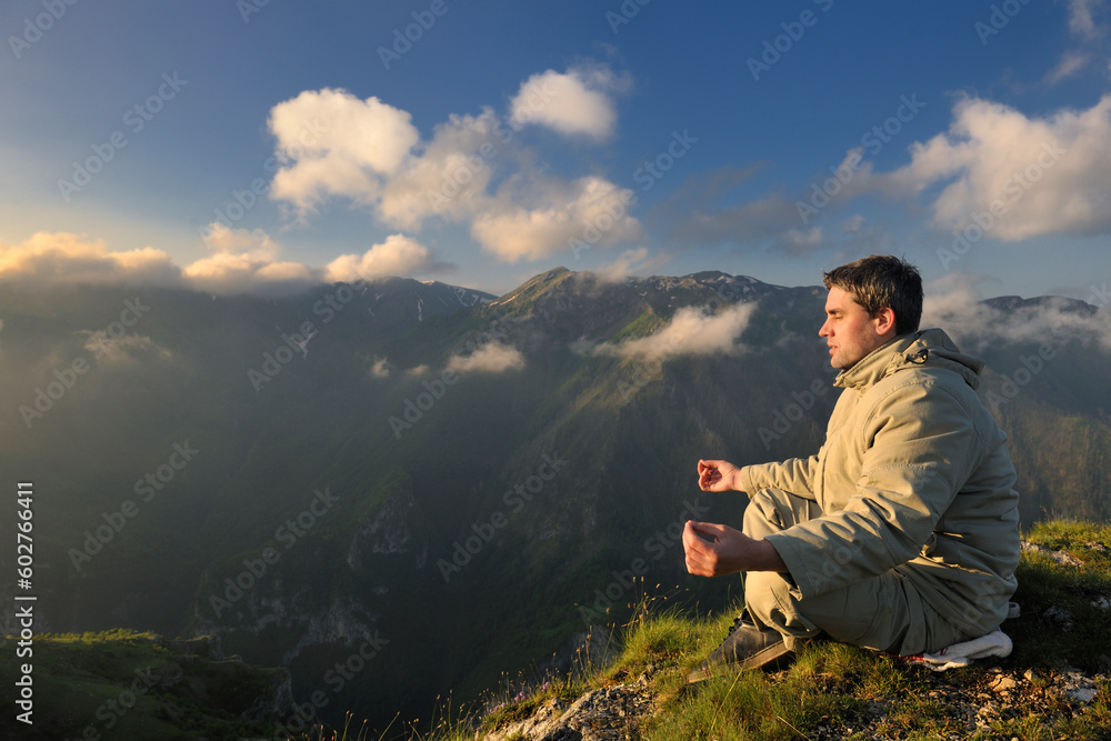 healthy young man practice youga in height mountain at early morning and sunrise healthy young man practice youga in height mountain at early morning and sunrise
