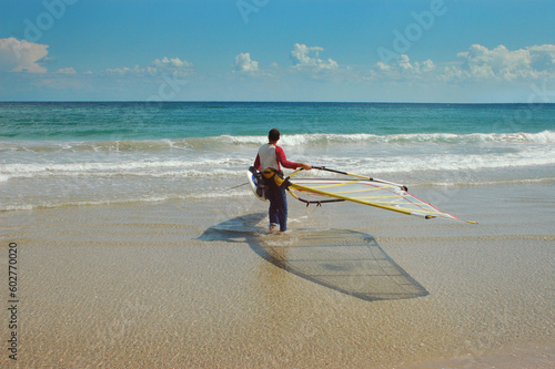 wind-surfer on a sunny sea. cool tropical beach