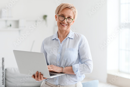 Mature psychologist working...