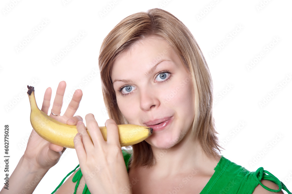 beautiful blonde young girl playing on a banana like a flute, isolated on white beautiful blonde young girl playing on a banana like a flute, isolated on white