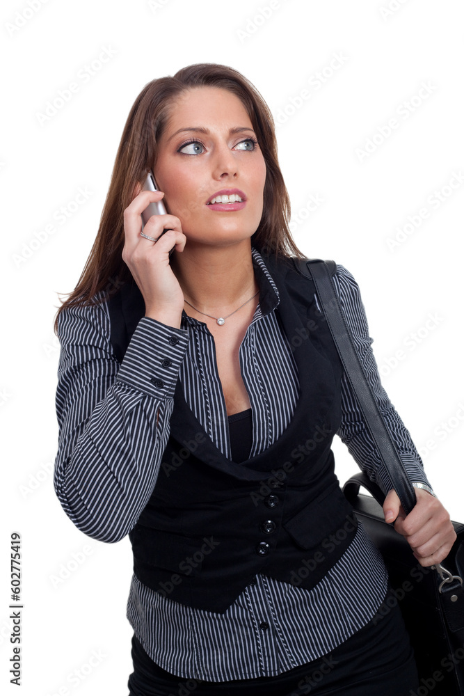 A young businesswoman in a dress is making a phone call A young businesswoman in a dress is making a phone call