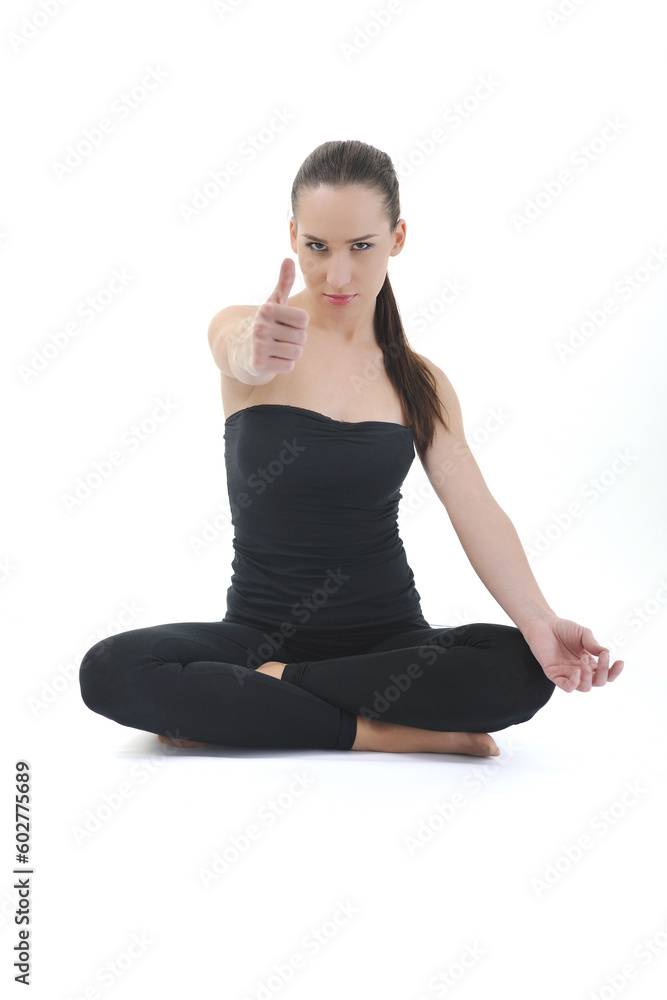 young brunette woman in black sport wear meditating yoga in lotus postition isolated on white background young brunette woman in black sport wear meditating yoga in lotus postition isolated on white background