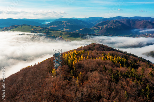 Aerial Drone Shot: Sightseeing Tower in Brezno, Autumn Scenery with Misty Morning and Cloud Inversion in Horehronie Region