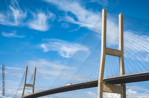 Fototapeta Naklejka Na Ścianę i Meble -  Alex Fraser Bridge on a sunny day. Taken in North Delta, Greater Vancouver Canada. Modern bridge pylon against blue sky