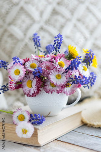 Bouquet of daisy with pink flowers in a ceramic white mug  wooden background. Romantic still life  summer or spring inspiration  cozy home decor. Greeting card for birthday  anniversary  Mother s Day