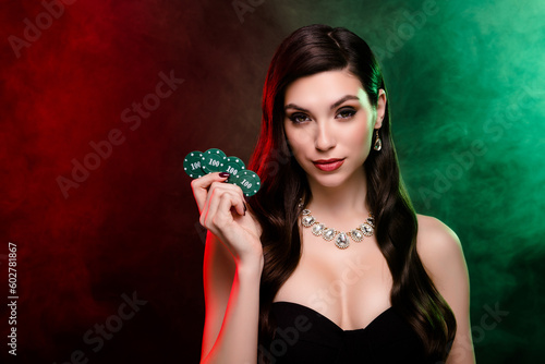 Experienced female dealer hold poker game hundred chips betting gambling poker club poker night cigarette smoke