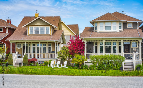 Perfect neighborhood. Houses in suburb at Spring in the north America. Real Estate Exterior Front Houses on a sunny day