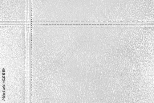 Natural, artificial white leather texture background with decorative seam. Material for sport items, clothes, furnitre and interior design. ecological friendly leatherette.
