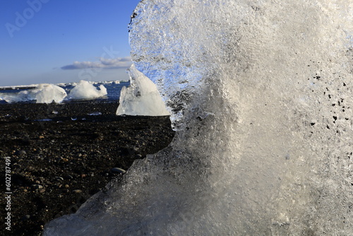 View of an iceberg on the beach of Breiðamerkursandur which is a glacial outwash plain in southeast Iceland. photo