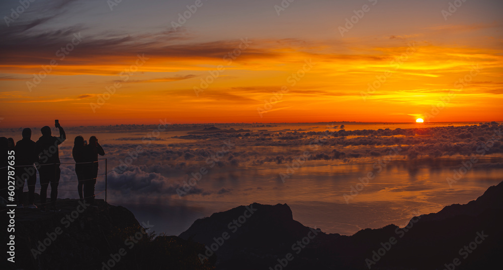 Silhouette of People watching Sunrise above clouds II.