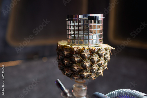 Stylish hookah with the aroma pineapple for relax.Pineapple shisha.Hookah lounge. photo