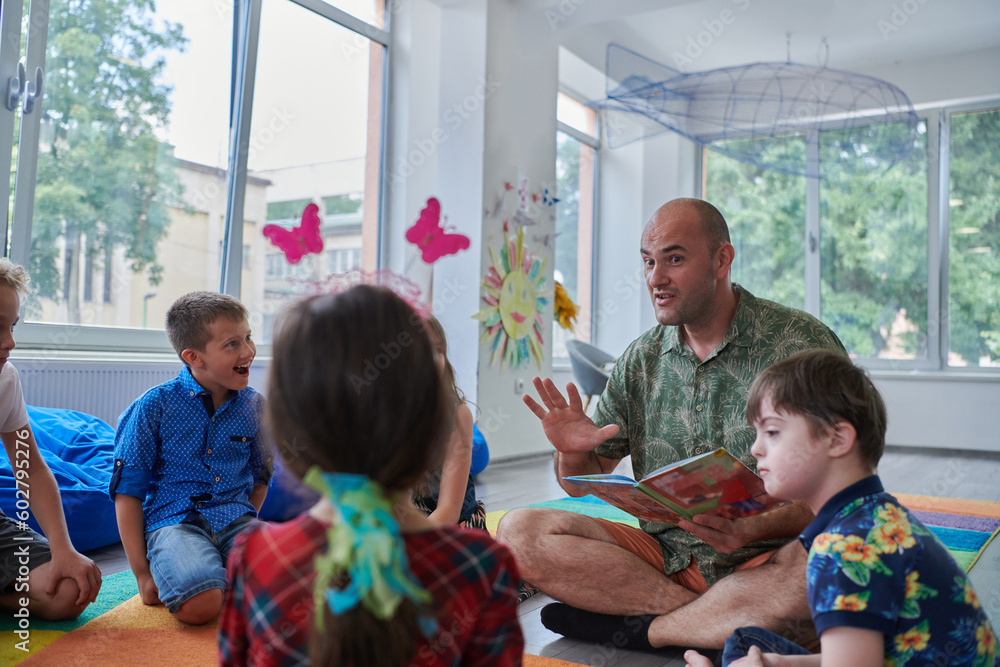 Reading time in an elementary school or kindergarten, a teacher reading a book to children in an elementary school or kindergarten. The concept of pre-school education. Selective focus Reading time in an elementary school or kindergarten, a teacher reading a book to children in an elementary school or kindergarten. The concept of pre-school education. Selective focus
