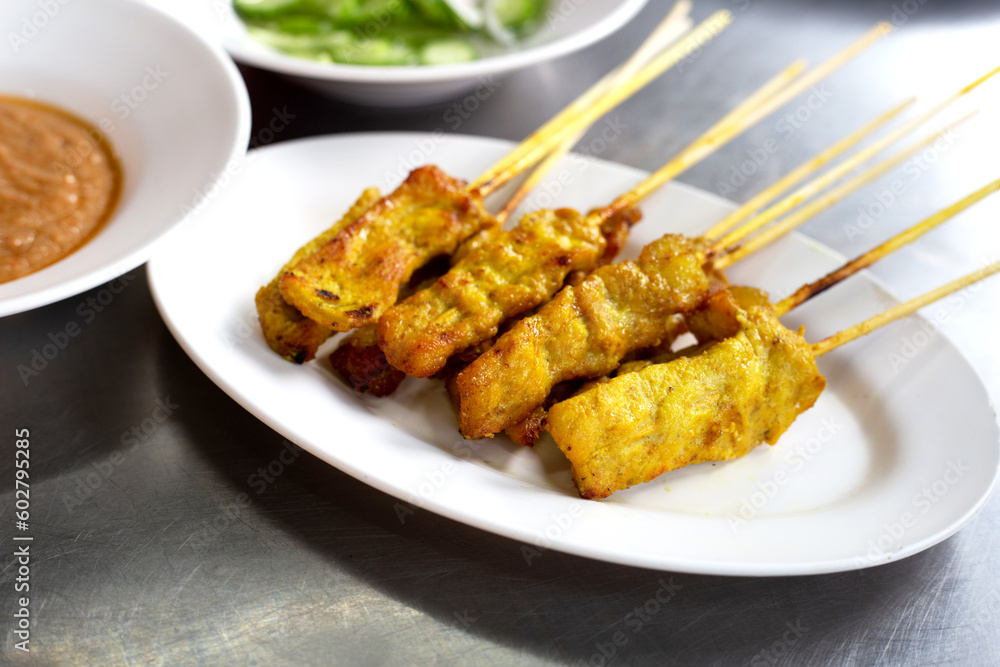 Grilled pork satay with peanut sauce