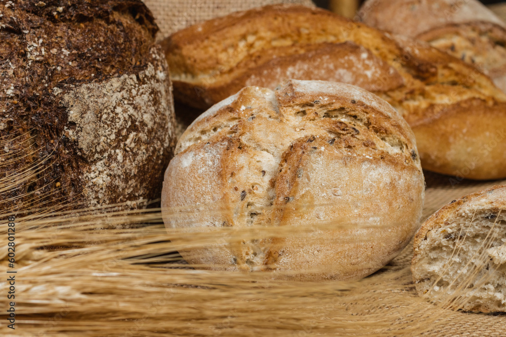 Many types of breads, with ears of wheat