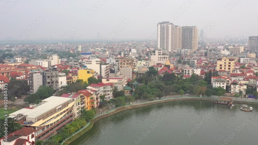 HANOI, VIETNAM - MAY, 2023: Drone aerial view Vietnam Hanoi city streets from above at rainy day. HANOI, VIETNAM - MAY, 2023: Drone aerial view Vietnam Hanoi city streets from above at rainy day.