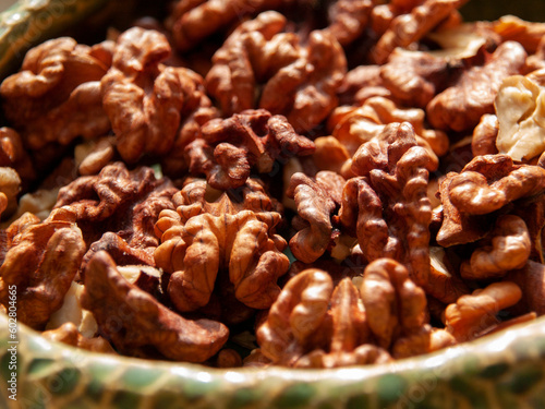 Peeled walnut lies in a bowl