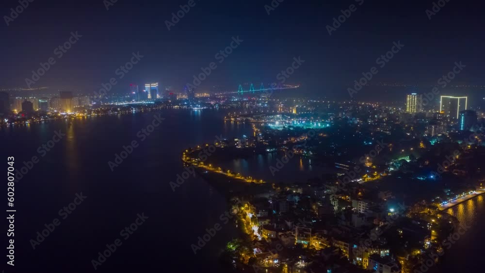 HANOI, VIETNAM - MAY, 2023: Drone aerial timelapse view Vietnam Hanoi downtown city streets from above at night. HANOI, VIETNAM - MAY, 2023: Drone aerial timelapse view Vietnam Hanoi downtown city streets from above at night.
