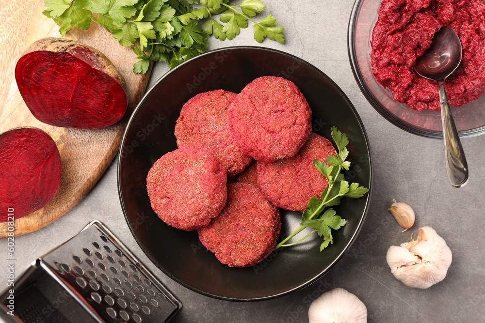 Delicious beetroot vegan cutlets and ingredients on light gray table, flat lay Delicious beetroot vegan cutlets and ingredients on light gray table, flat lay