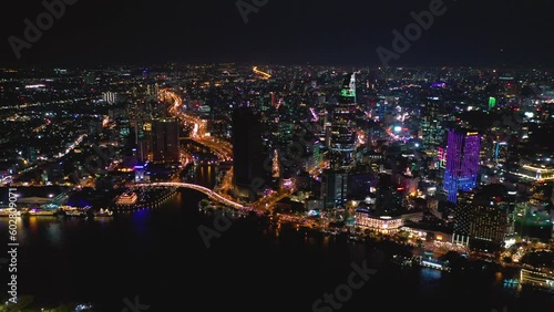 Wallpaper Mural Ho Chi Minh City, Vietnam - May, 2023: Aerial view of business downtow city center of Saigon riverside at Ho Chi Minh City, night drone view from above. Torontodigital.ca