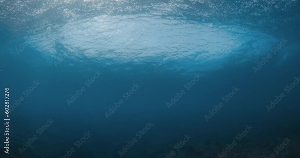 Powerful wave underwater in blue ocean. Underwater view of wave Powerful wave underwater in blue ocean. Underwater view of wave