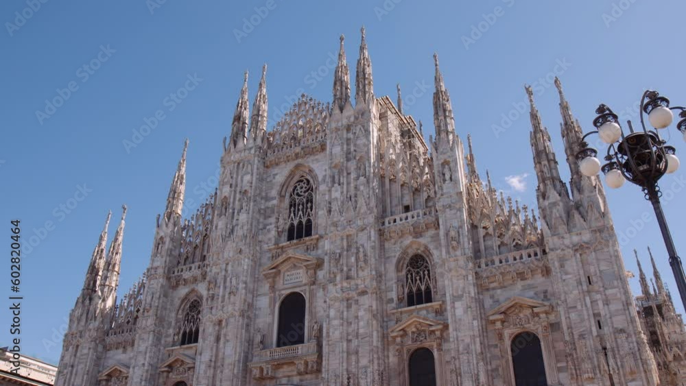 Breathtaking View Of The Exterior Of Milan Cathedral On A Clear Sunny Day In Milan, Italy. low angle Breathtaking View Of The Exterior Of Milan Cathedral On A Clear Sunny Day In Milan, Italy. low angle