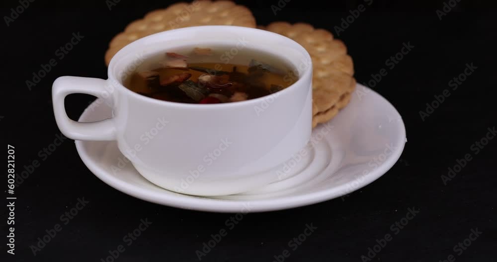 crispy cookies with chocolate filling between cookies, fresh crispy cookie sandwich and tea crispy cookies with chocolate filling between cookies, fresh crispy cookie sandwich and tea
