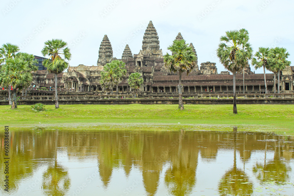 Scenery of Angkor Wat across the lake and the reflection in the water during sunrise. UNESCO world heritage site in Cambodia