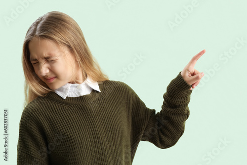 Scared little girl using vi...