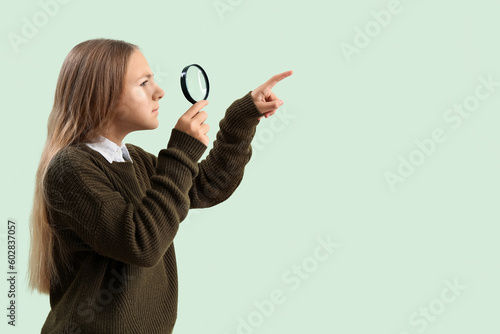 Little girl with magnifier ...