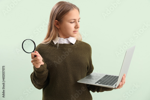 Little girl with magnifier ...