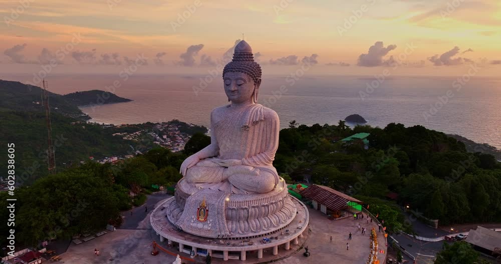 aerial view around Phuket big Buddha in beautiful sunset..360 degree view on Phuket big Buddha viewpoint..Video clips for travel and religious ideas..smooth cloud in stunning sky background. aerial view around Phuket big Buddha in beautiful sunset..360 degree view on Phuket big Buddha viewpoint..Video clips for travel and religious ideas..smooth cloud in stunning sky background.
