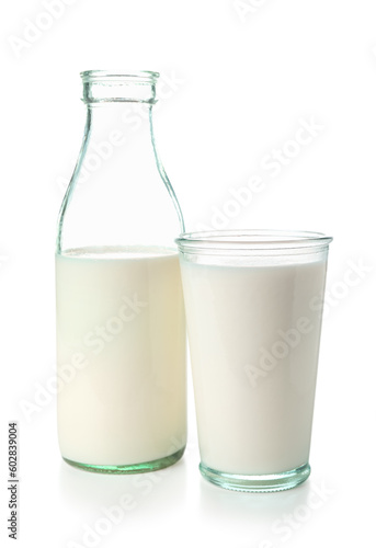 Bottle and glass of milk on white background